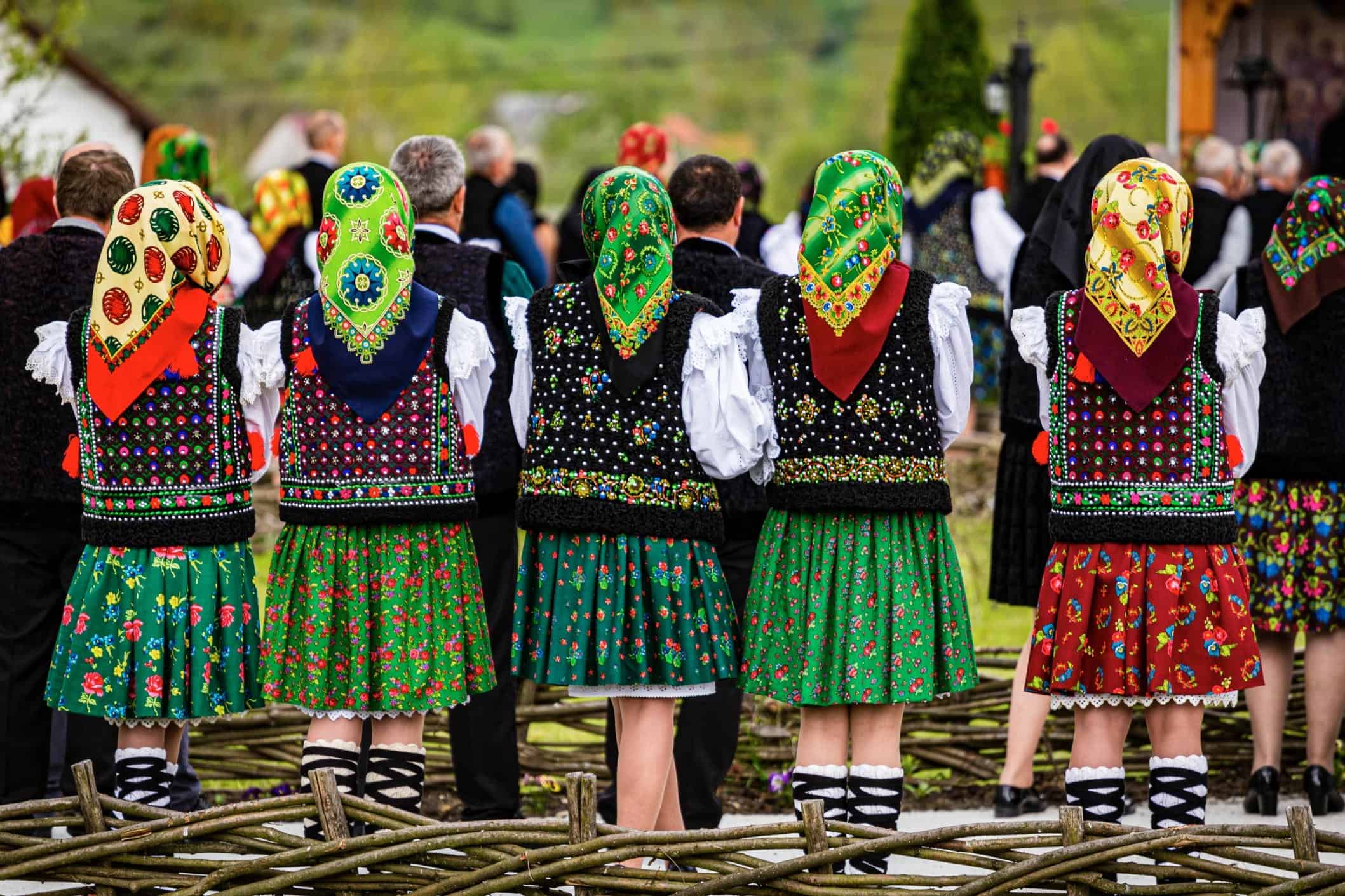 womens backs showing traditional costumes in the northern part of Romania
