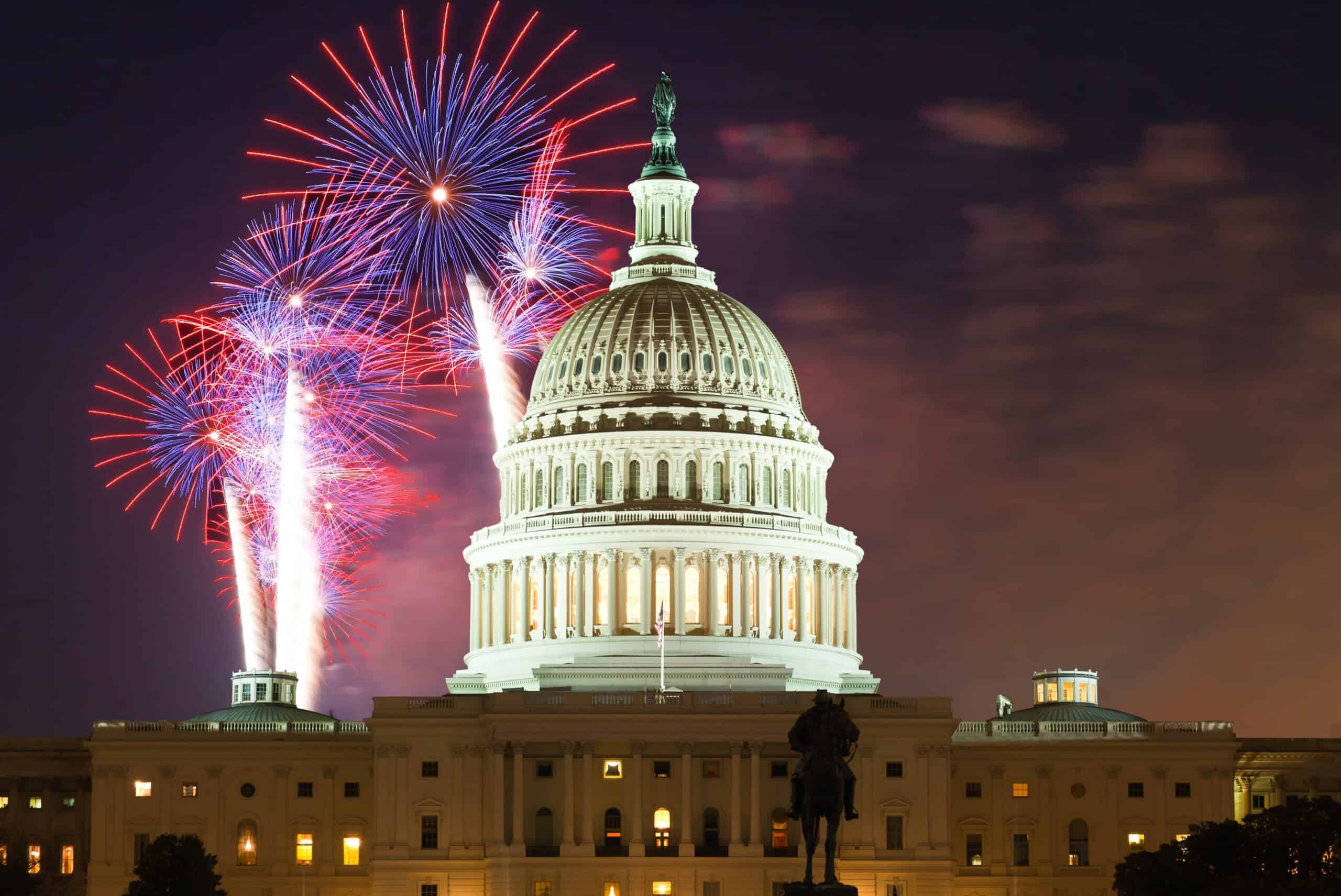 Fireworks happening over the U.S. Capital. 