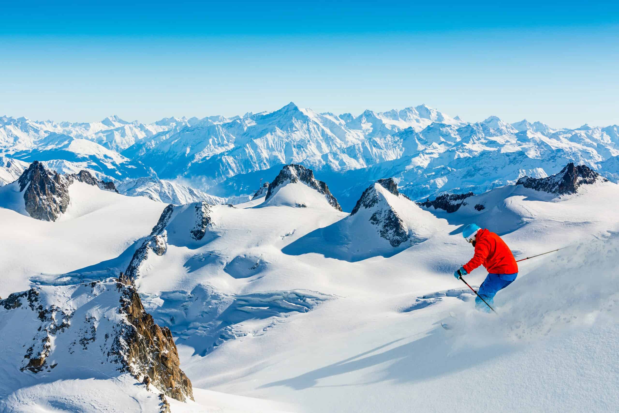 Skier skiing downhill Valle Blanche in french Alps in fresh powder
