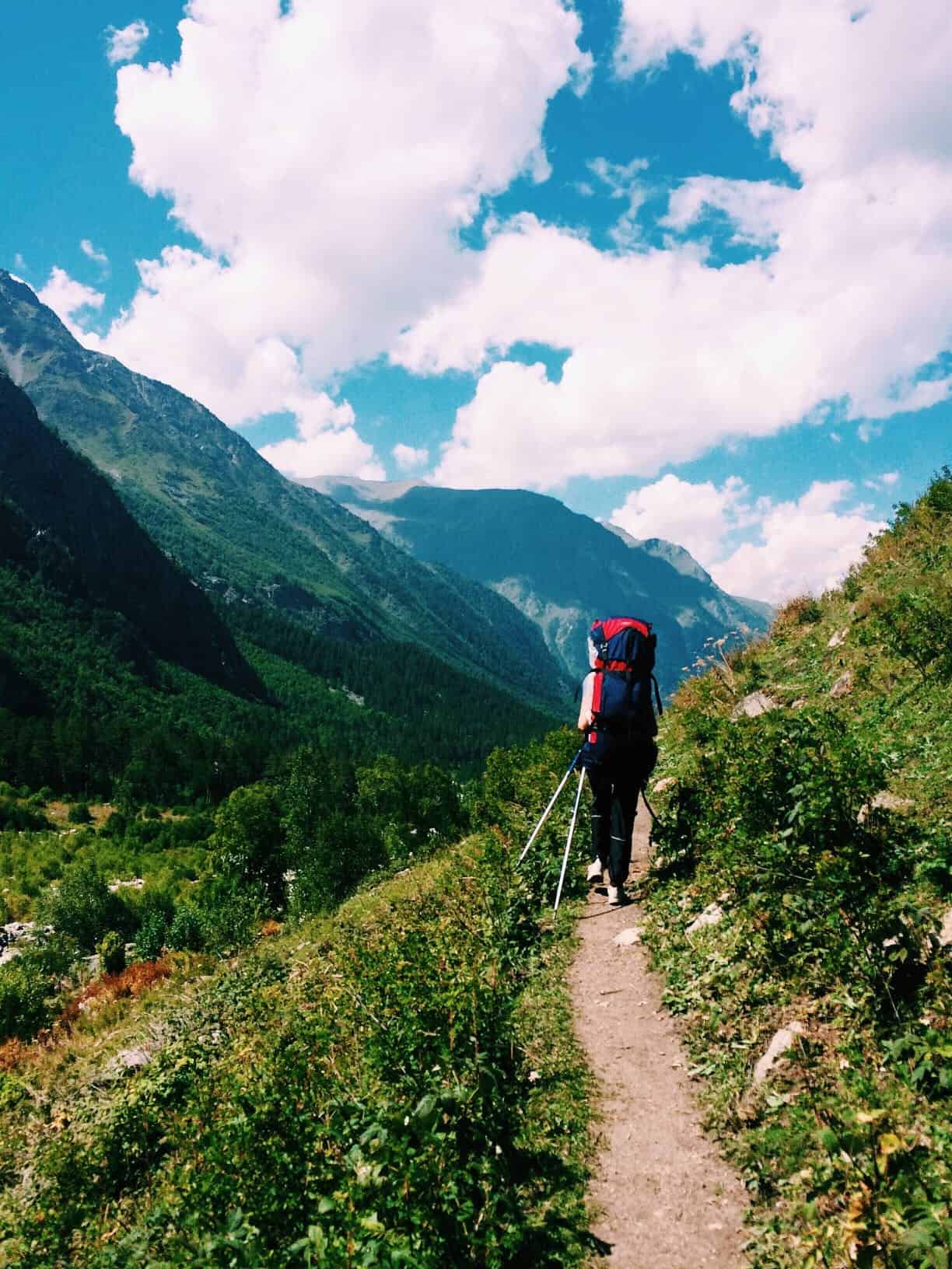 Backpacker hiking in a mountain range