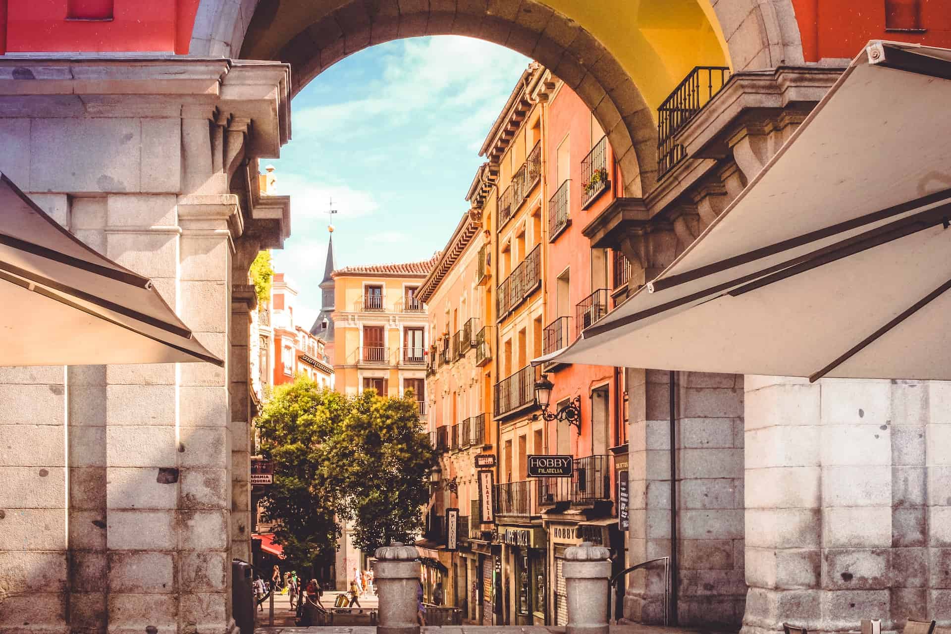 Archway leading to a street in a city in Spain.