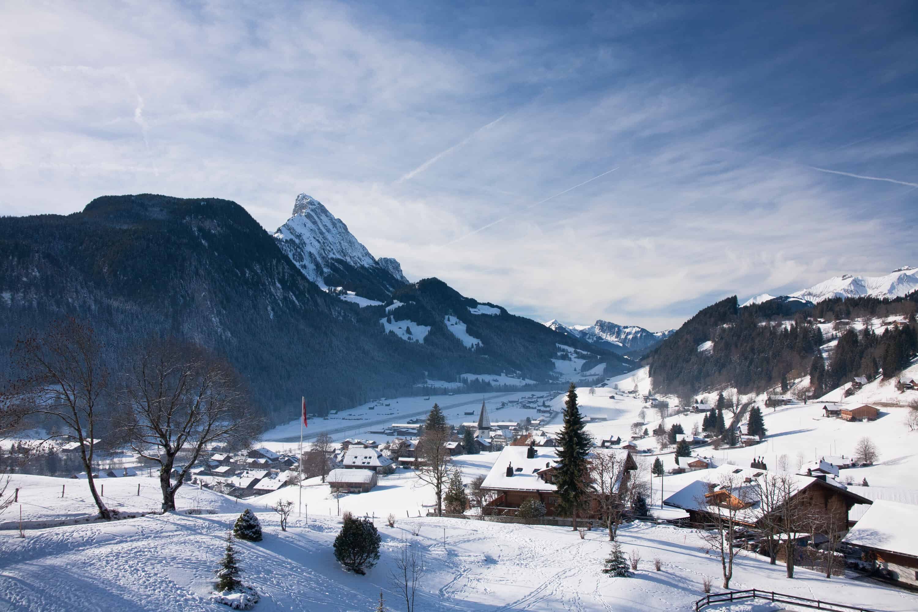 Landscape of Gstaad in Switzerland with snow in the winter.