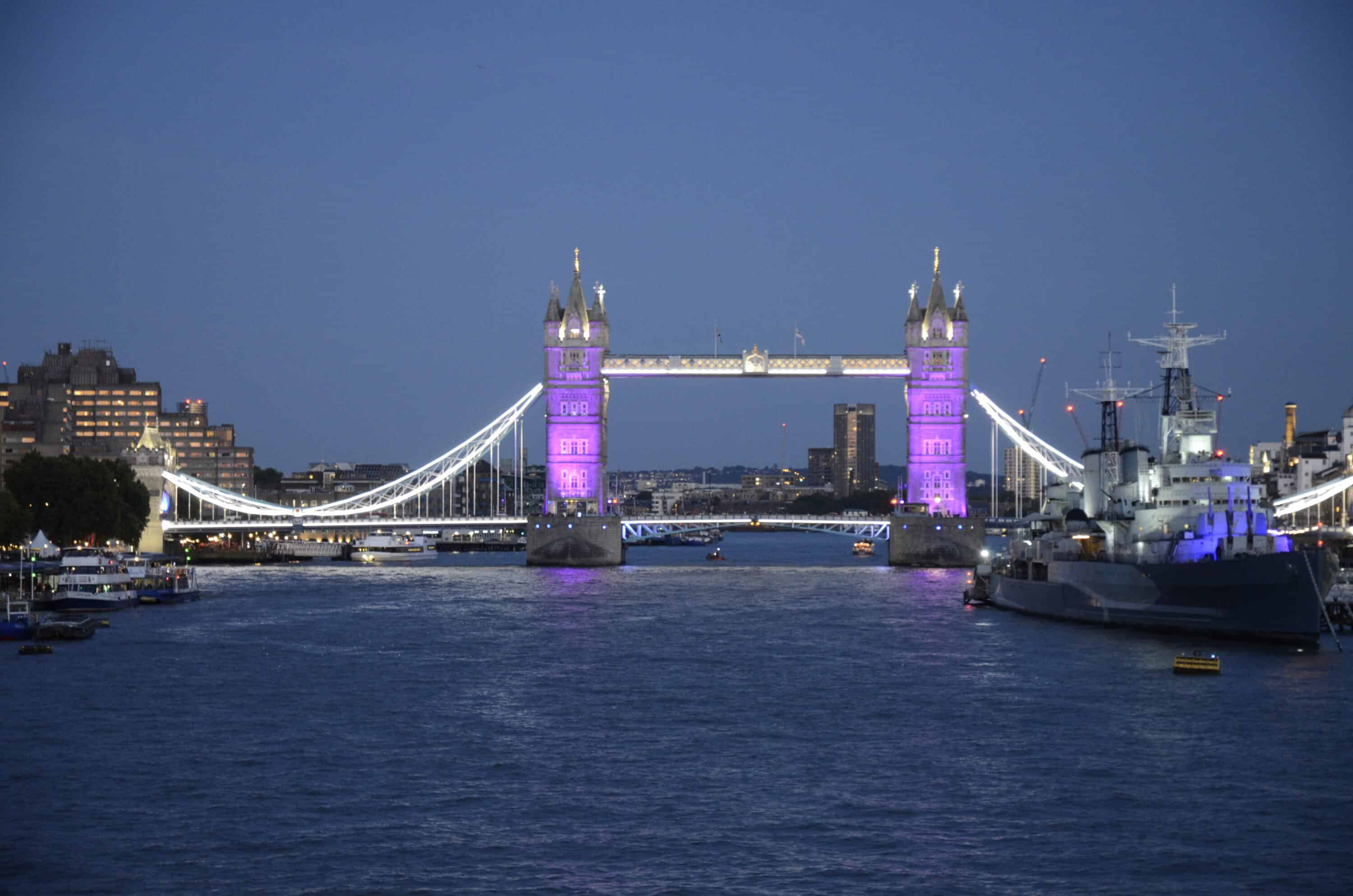 London Tower Bridge with purple lights on because of Queen Elizabeth's death