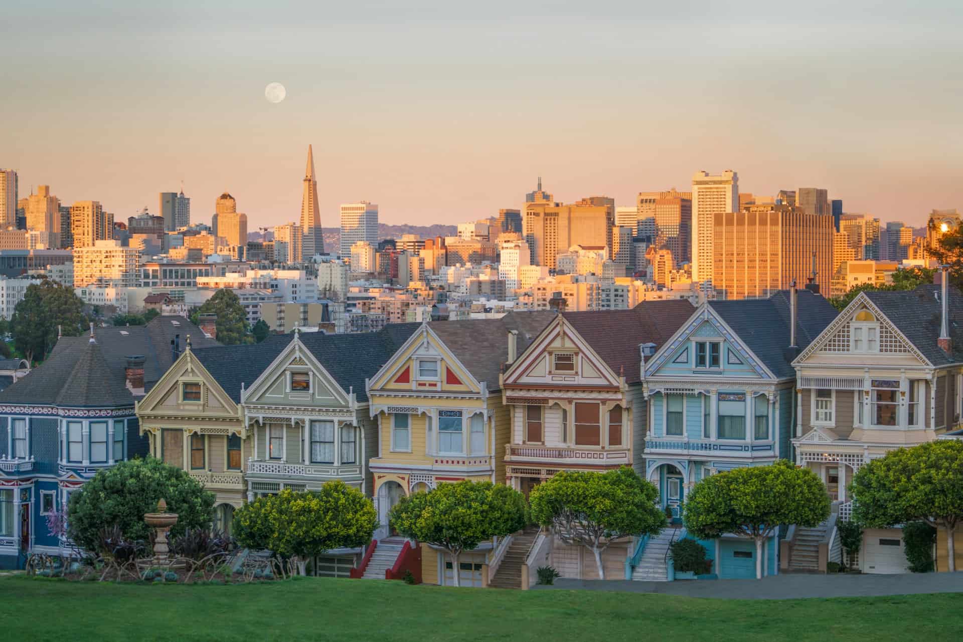 Painted Ladies houses in San Francisco with the city skyline in the background. 
