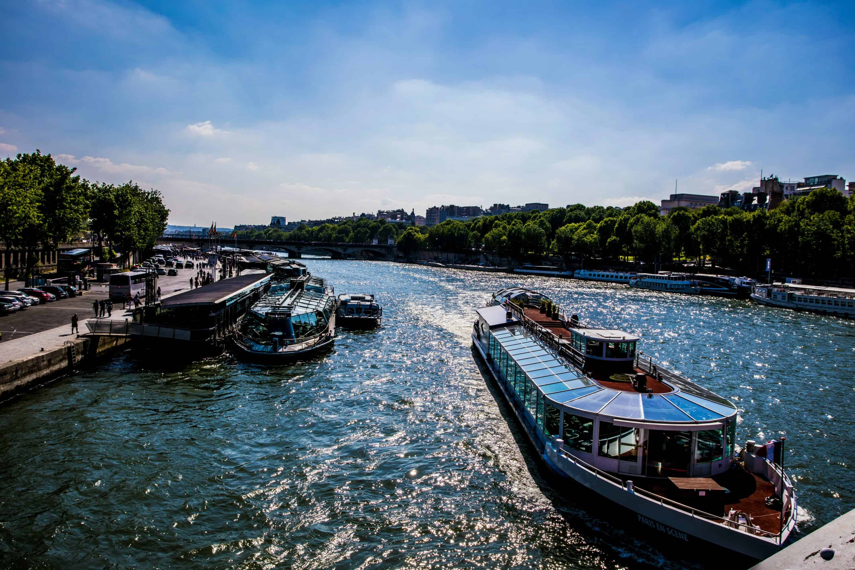 Seine river view with a boat moving under a bridge